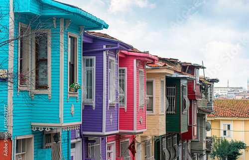 Traditional old wooden Houses in the Street in Istanbul, classic Ottoman wooden Architecture in Turkey photo