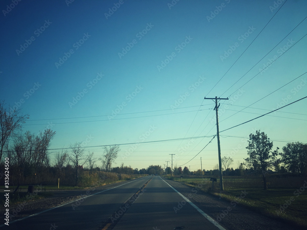 Fototapeta premium Autumn road in the afternoon
