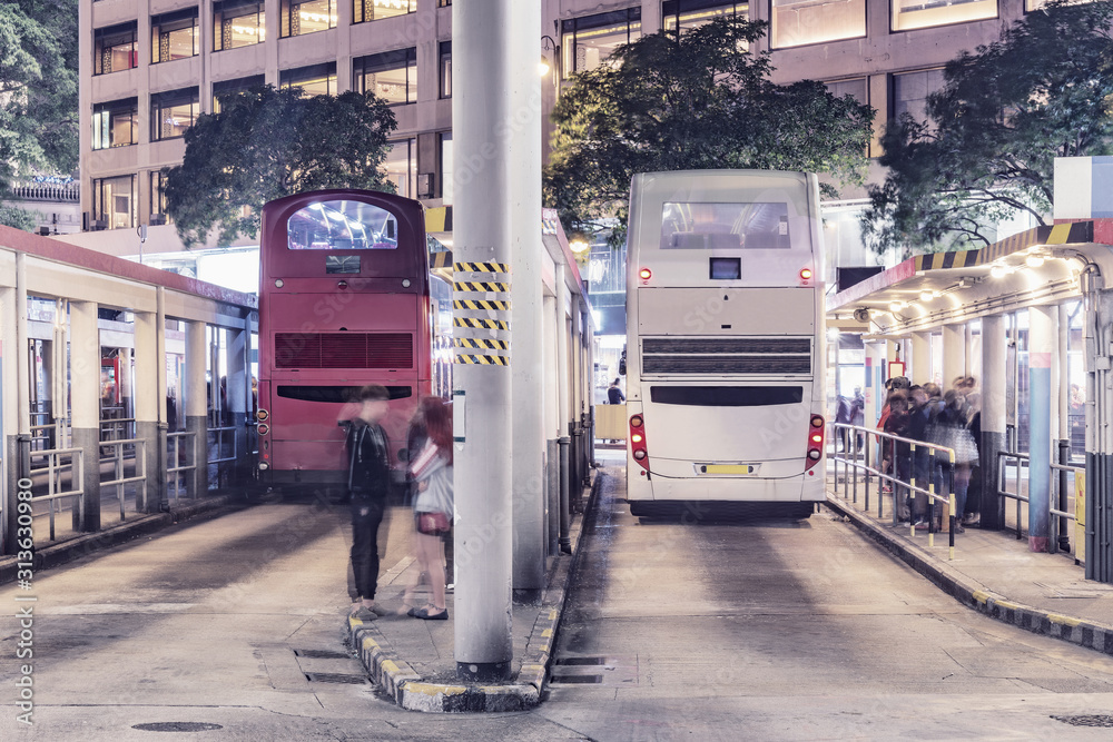 Buses stand by the platforms before departure. Kowloon.