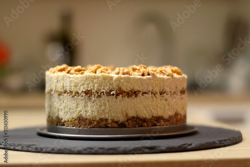 Vegan cake with walnuts, cashew nuts and raisins. Selective focus.