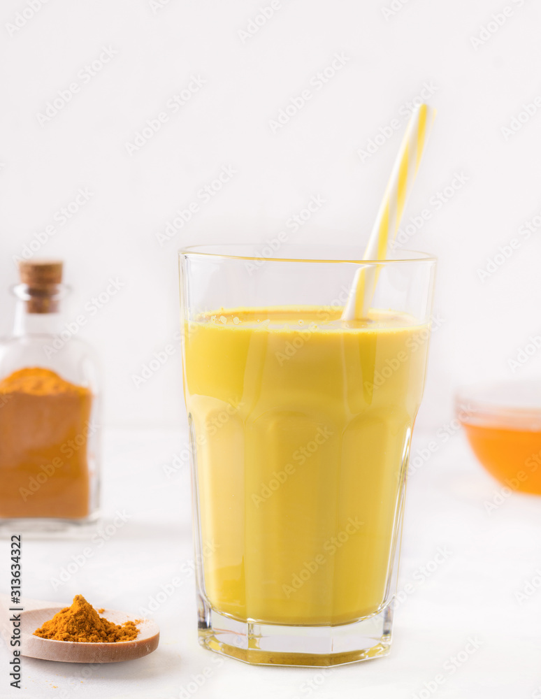 indian drink golden milk next to ingredients
