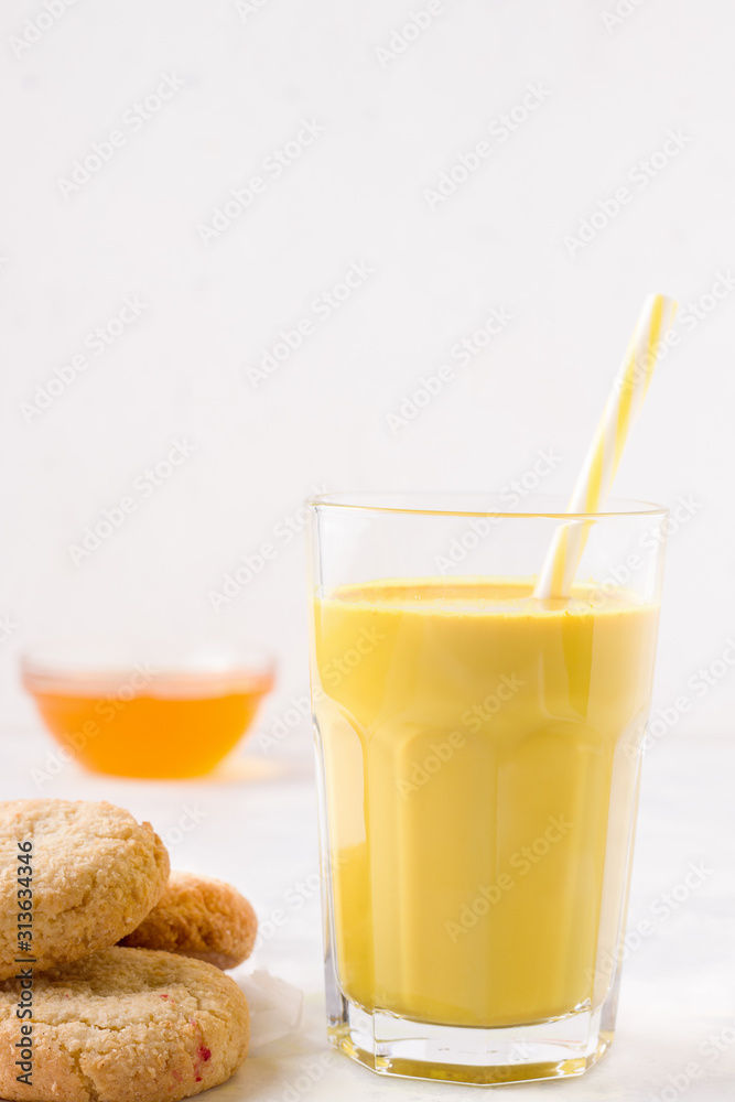 indian drink golden milk next to a swirl. have copy space indian drink golden milk next to a swirl. have copy space