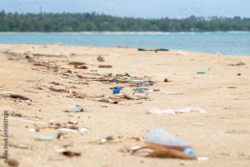 Fototapeta Naklejka Na Ścianę i Meble -  Spilled garbage on the beach