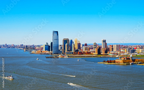 Aerial view of Governors Island with Brooklyn and Skyline with Skyscrapers in Financial Center, Manhattan Area, New York City, America. USA. American architecture building. Panorama of Metropolis NYC