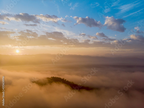 Aerial view forest in morning fog mist, breathing mountains, Sunshine on The Morning Mist