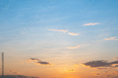 Heavenly abstract summer gentle background. Beautiful picturesque bright majestic dramatic evening morning sky at sunset or dawn. In orange and blue in pastel