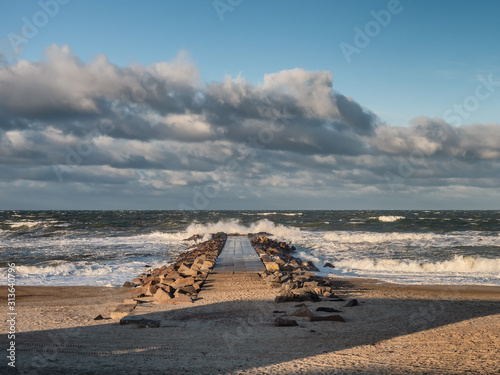 Stormy beach in Thyboroen, West Denmark photo