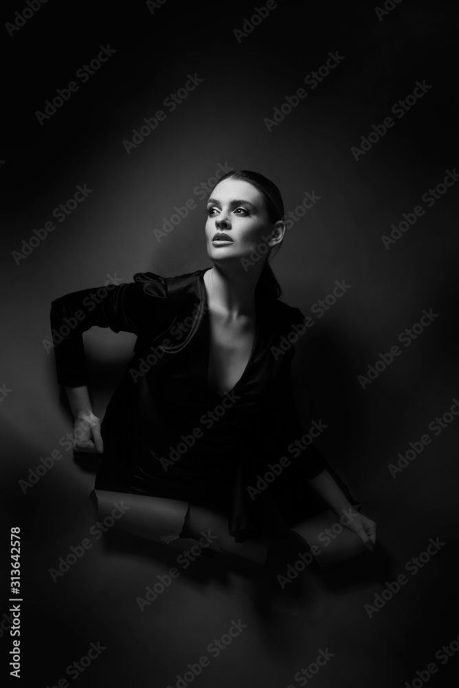Premium Photo | The little black dress simple yet stand out style studio  shot of a fashionable young woman posing in a black dress