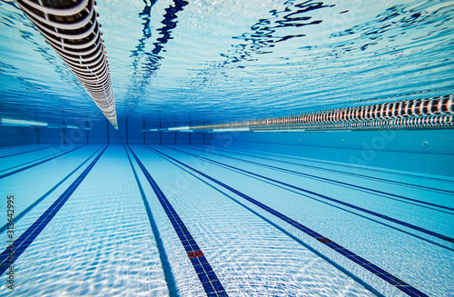 Olympic Swimming pool under water background.
