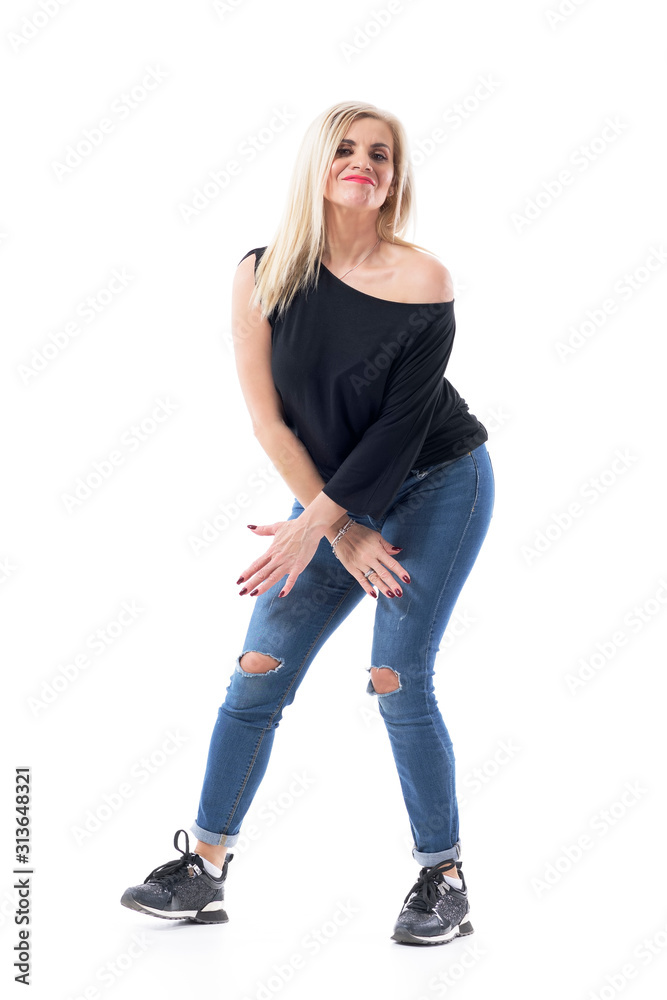 Attractive sexy middle aged blonde hair woman dancing wearing jeans and off  shoulder black shirt. Full body length isolated on white background. Stock  Photo | Adobe Stock
