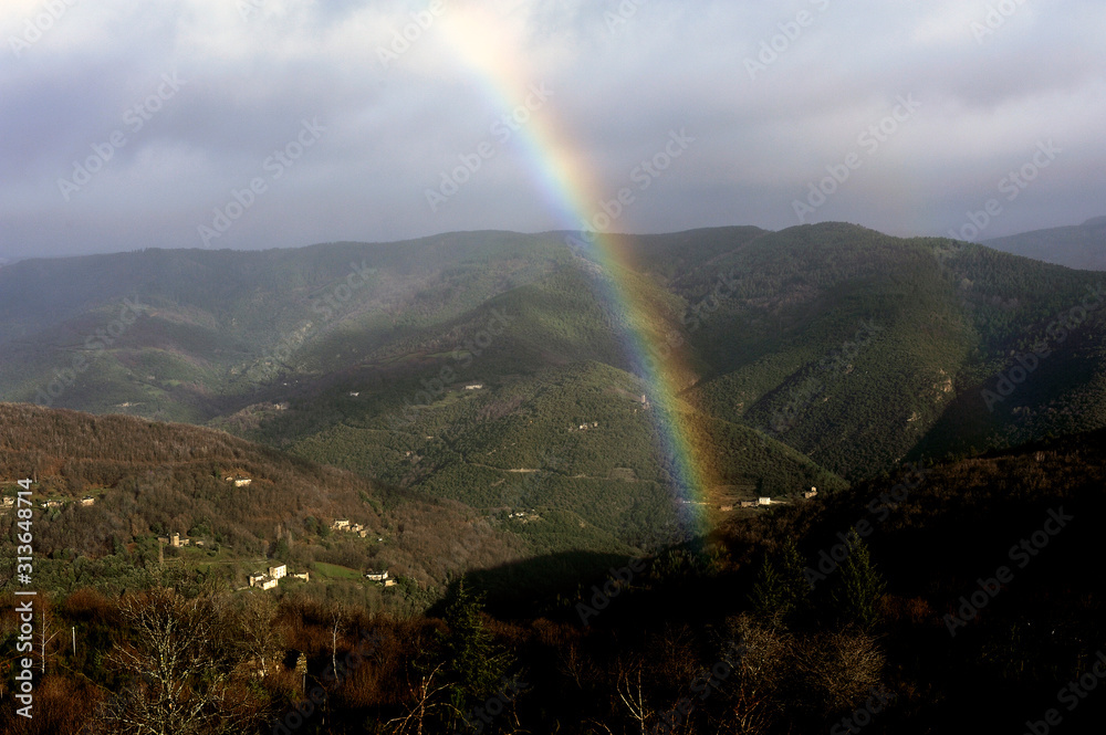 rainbow in the mountains in the Cevennes and the French department of Lozere rainbow in the mountains in the Cevennes and the French department of Lozere