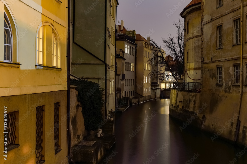 narrow street and river at night