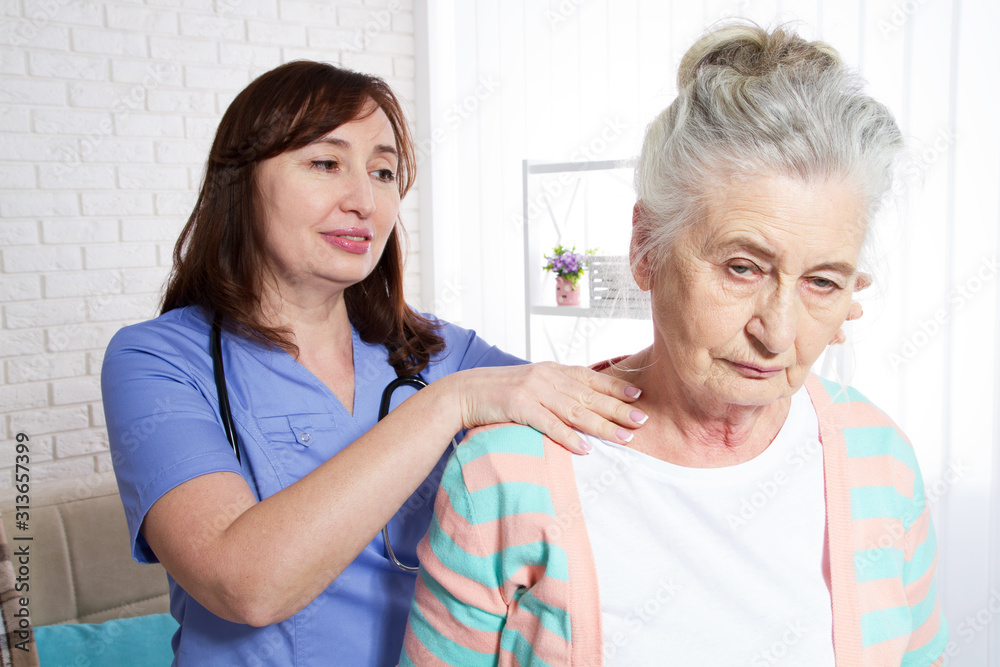 An elderly woman and a rehabilitation doctor - rehabilitation and health concept of older people An elderly woman and a rehabilitation doctor - rehabilitation and health concept of older people