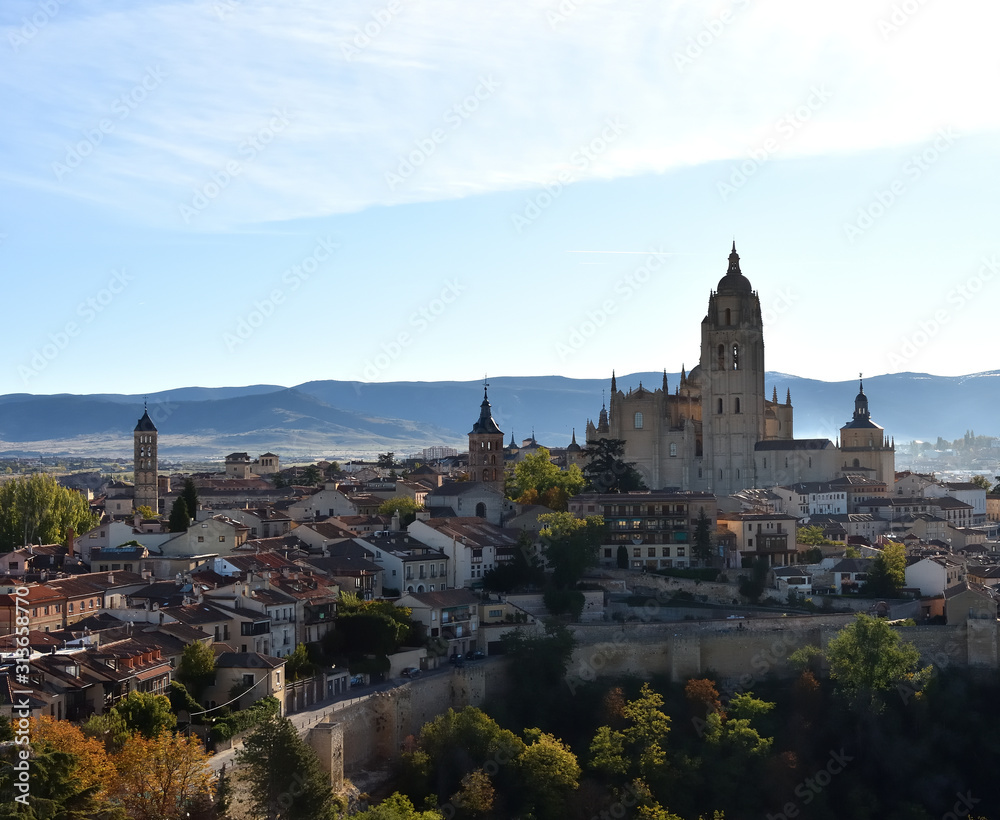 Panoramic view of Segovia illuminated by the morning light on a sunny day