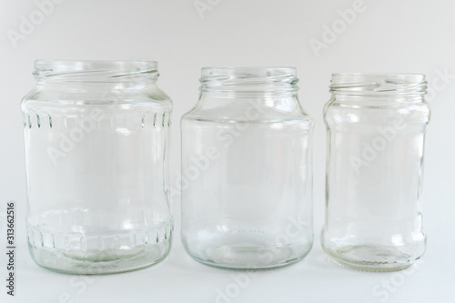 Glass jars at gray monochrome background. Zero waste concept.