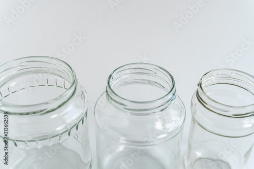Glass jars at gray monochrome background. Zero waste concept.