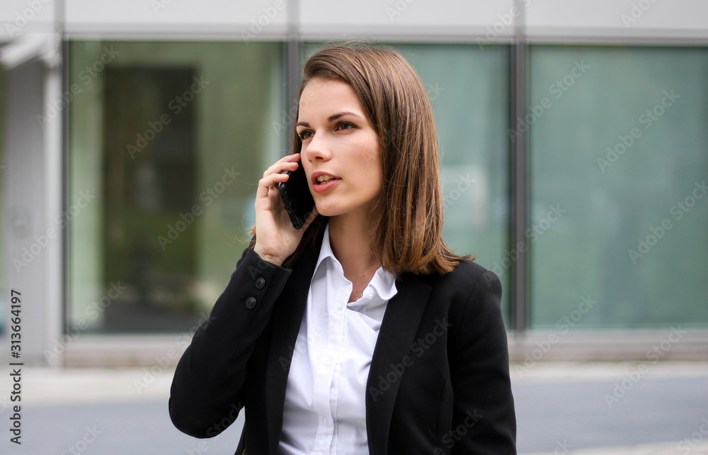 Portrait of a young woman talking on the phone Portrait of a young woman talking on the phone
