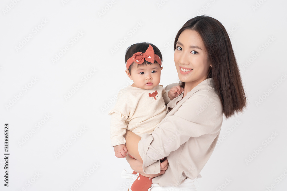Asian mother and adorable baby girl are  happy on white background