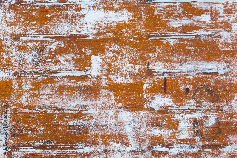 rusted metal surface with white patches