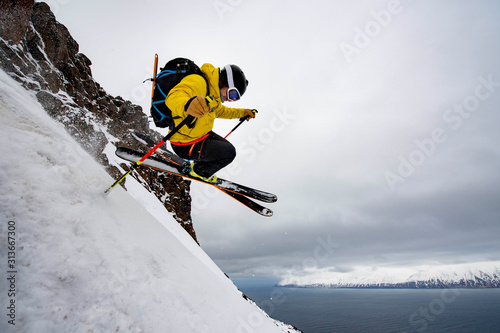 A man backcountry skiing to the ocean at in Iceland. photo