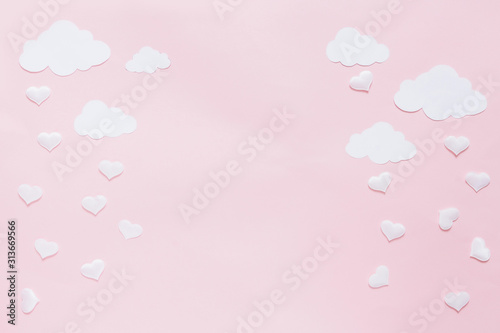 Festive flat lay. Foil heart shaped balloons on a pastel pink background. The concept of love Holiday Valentine's Day or wedding, bachelorette party, birthday.