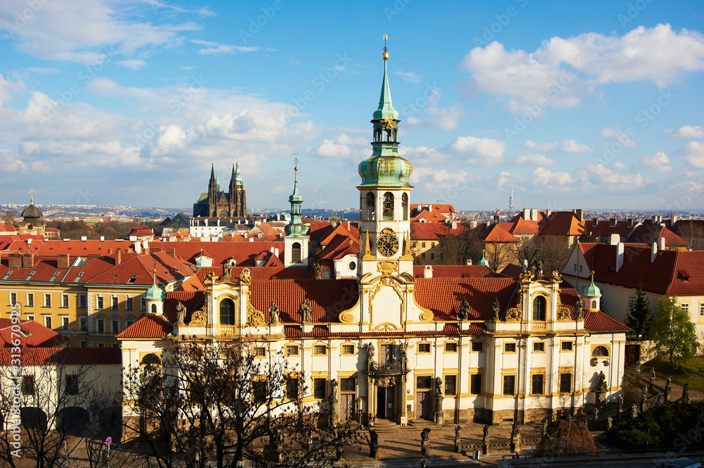Obraz premium Loreta is a pilgrimage destination in Hradcany, a district of Prague, Czech Republic. Saint Vitus Cathedral background. Selective Focus