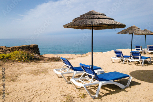 Beach loungers on the background of the sea and sky,summer vacation