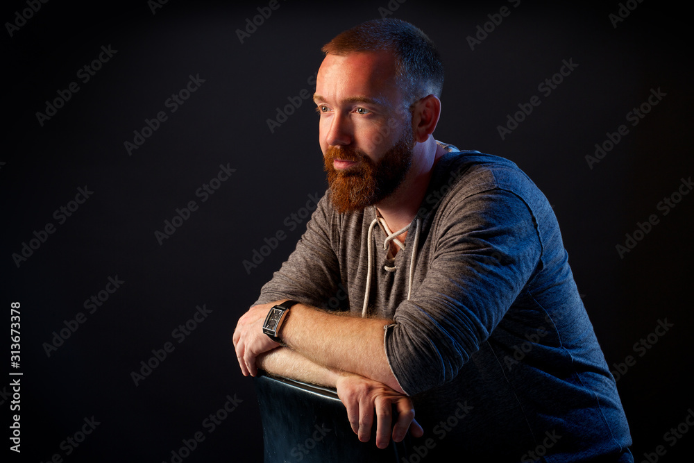 brutal man with a beard in the studio brutal man with a beard in the studio