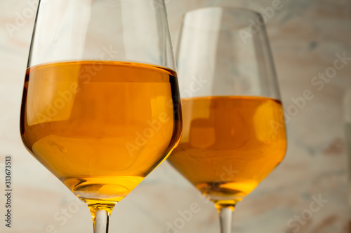 tall glass of rich orange wine