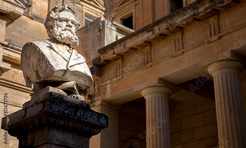 The bust of Giosue Carducci in front of the Convitto Palmieri library on the Piazzetta Carducci in Lecce Puglia Italy photo