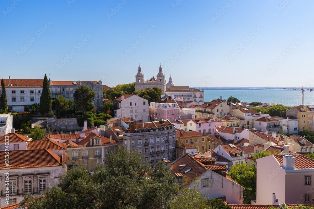 View of Church of Sao Vicente of Fora (Igreja de Sao Vicente de Fora) and old buildings in Alfama district in Lisbon, Portugal.