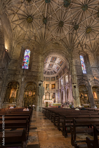 Few people at the main chapel of the Church of Santa Maria at Mosteiro dos Jeronimos  Jeronimos Monastery  in Belem  Lisbon  Portugal.