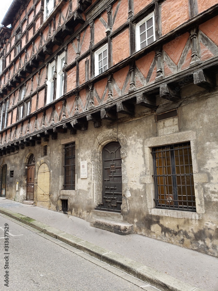 Old building on Rue du Palais in Bourg-en-Bresse, France. 