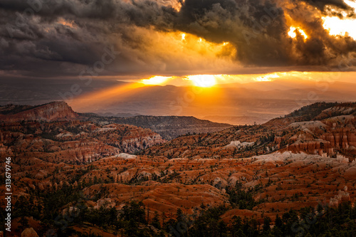 The first sun rays hit the hoodoos at the Bryce Canyon, Utah