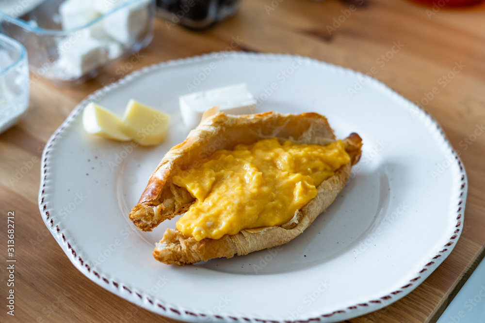 Breakfast of Croissant Stuffed with Scrambled Eggs. Breakfast of Croissant Stuffed with Scrambled Eggs.
