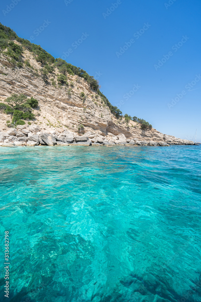 Fototapeta premium Clear azure coloured sea water, Sardinia, Italy