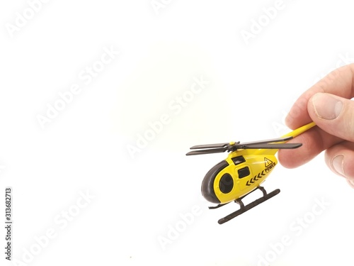 Toy helicopter yellow on white background