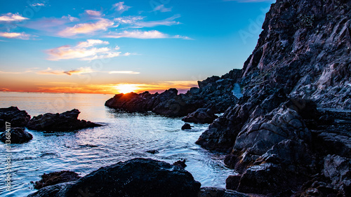 Beautiful sunset over the sea and rocks