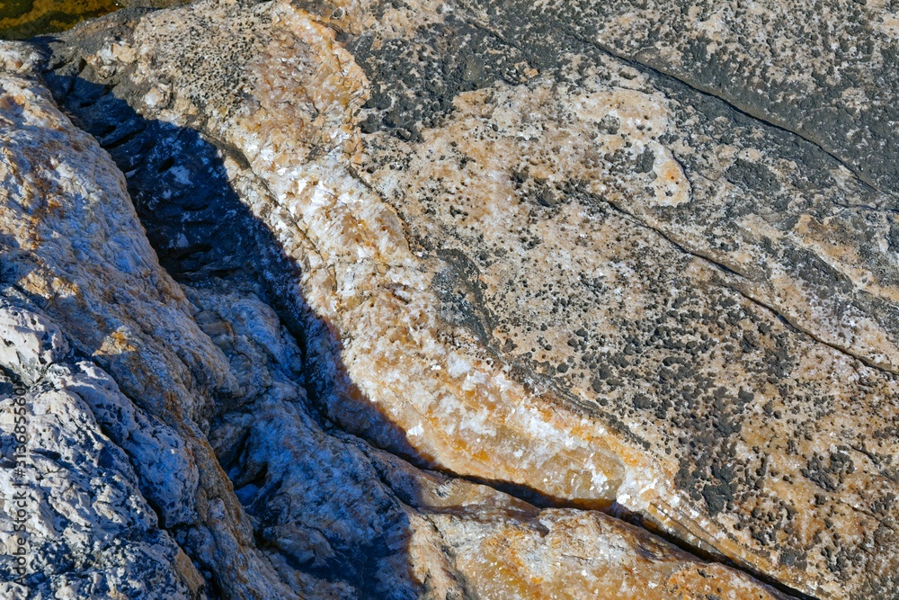 Naklejka premium Rough stone surface as background texture