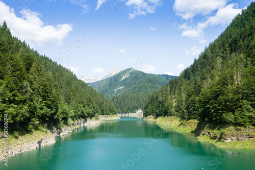 Val Noana artificial lake, Mezzano, Italy. Mountain landscape photo