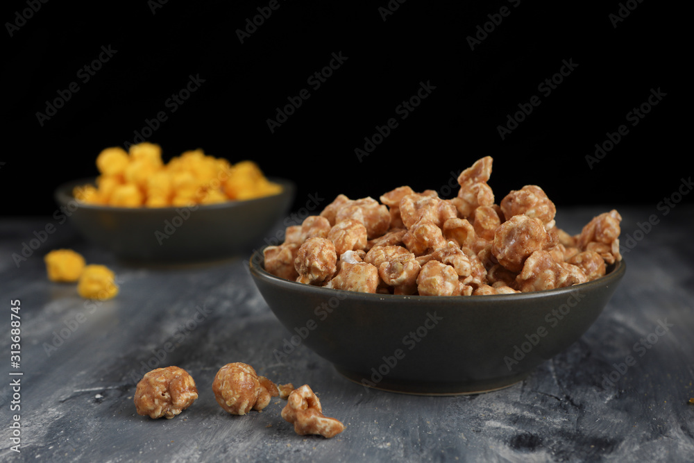 Caramel corn in a shallow green bowl. Caramel corn in a shallow green bowl.