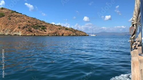 Sailing on the pleasure boat near islands in the sea. Summer vacation. Ocean view. 4k video