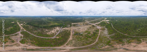 Fototapeta Naklejka Na Ścianę i Meble -  360-degree panoramic aerial view WITHOUT SKY at an abandoned airfield in the forest