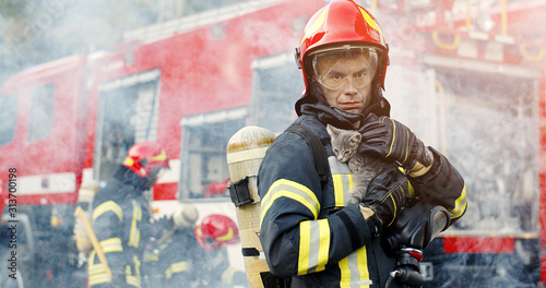 Canvas Print Firefighter in fire fighting operation
