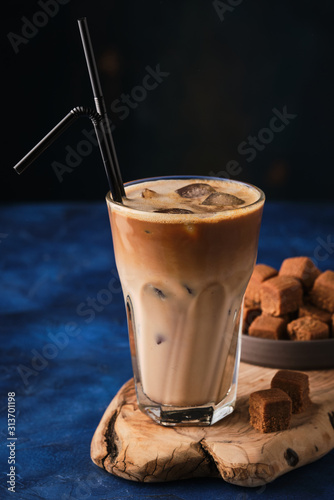 Ice Coffee with toffee  on a wooden board photo