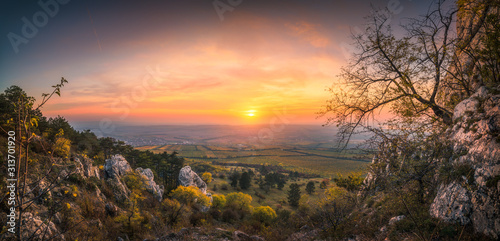 Colorful Autumn Sunset over Vineyards as Seen from Rocky Hill in Palava Protected Area near Mikulov in South Moravia, Czech Republic photo