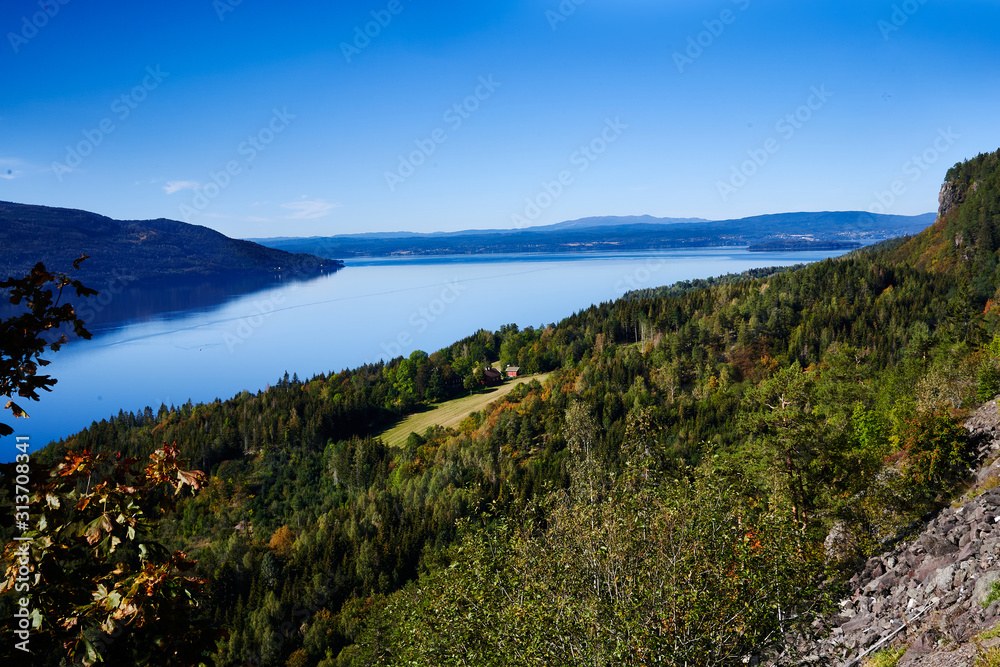 Tyrifjorden. A view from high up, looking over the fjord. A farm i located in the distance. 