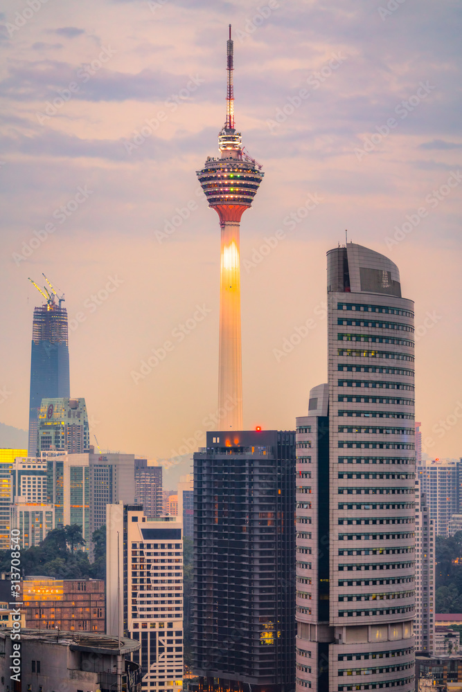 KUALA LUMPUR, MALAYSIA - FEBRUARY 19, 2018:.The Menara Kuala Lumpur Tower illuminated at night. Builted in 1995, is the 7th tallest communication tower in the world.