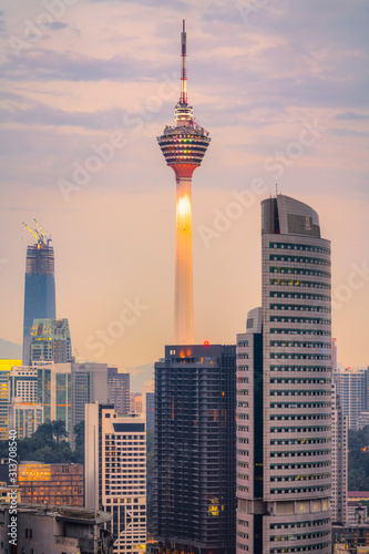 KUALA LUMPUR, MALAYSIA - FEBRUARY 19, 2018:.The Menara Kuala Lumpur Tower illuminated at night. Builted in 1995, is the 7th tallest communication tower in the world. photo