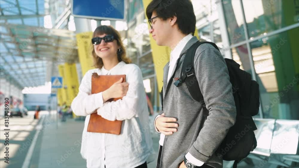 Businessman and businesswoman waiting for a taxi Businessman and businesswoman waiting for a taxi